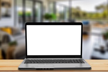 Fototapeta premium Modern laptop with white blank screen on desk