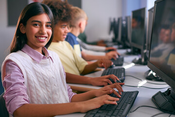 Portrait Of Female Secondary Or High School Student Sitting At Computer Screen In IT Class  © Monkey Business