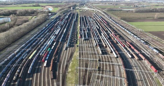 large industrial train depot, shipment and logistics over rail road track.