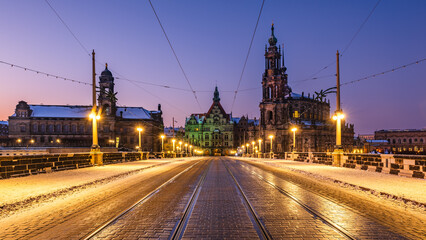 Fototapeta na wymiar The Augustus Bridge with Christmas decorations in Dresden in the dawn. 