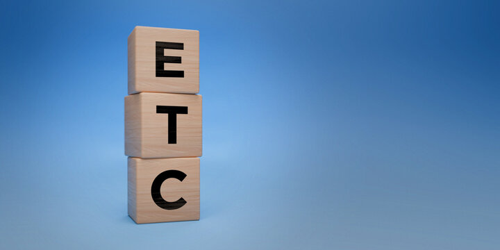 Wooden blocks with ETC acronym, exchange-traded commodity concept, investment in tradable goods, blue background with space for text, financial assets and commodities trading concept