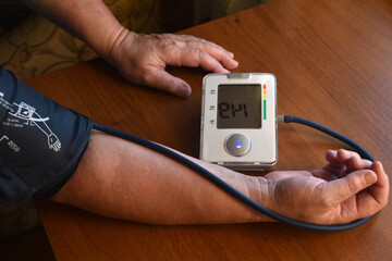 Measurement of blood pressure in a pensioner. A blood pressure monitor for humans. Treatment of a pensioner.