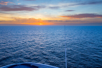 Beautiful Orange Sunset in the Ocean captured from a ferry deck between Denmark, and Faroe Islands
