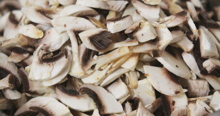 Chef Slicing Mushrooms in Kitchen