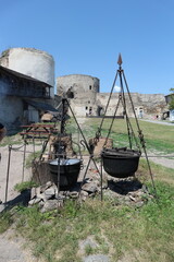 Cauldrons and furnaces on the territory of the fortress. Old large cauldrons for cooking.