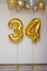 gold and silver helium balloons and gold foil numbers34