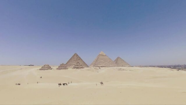 An aerial view of the Pyramids of Giza during a light dust storm. Color left as neutral for editing. 