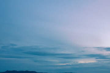 Peaceful romantic sky with soft pastel clouds surrounded by cozy picturesque environment 