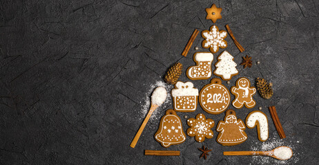 Christmas composition with gingerbread on gray background. Merry Christmas and Happy New Year. Flat lay. Copy space. Banner