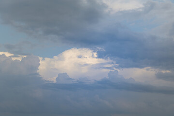 Cumulus clouds in the blue sky close-up, among the clouds