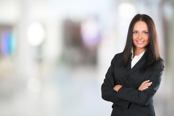 Young happy business woman posing