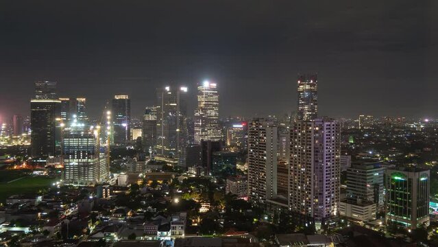 night time illumination jakarta central cityscape construction rooftop panorama 4k timelapse indonesia