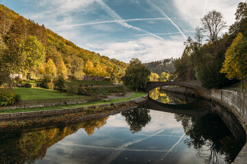 Esch-sur-Sure town situated on picturesque bank of Sauer River - obrazy, fototapety, plakaty