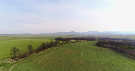 Tractor spray fertilize on field with chemicals in agriculture field.