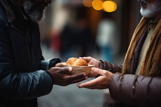 Hands of Compassion Volunteers Extend Generosity, Offering Nutritious Food to a Needy Elderly Homeless Man. A Tale of Donation, Charity, Sharing, Help, and the Essence of Hope. 