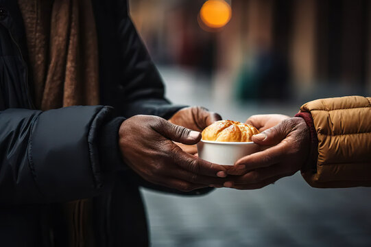 Hands of Compassion Volunteers Extend Generosity, Offering Nutritious Food to a Needy Elderly Homeless Man. A Tale of Donation, Charity, Sharing, Help, and the Essence of Hope. 
