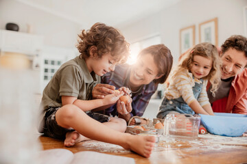 Happy family baking cookies in the kitchen