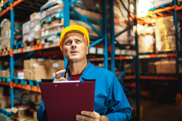 Warehouse worker doing inventory analyzing shipment