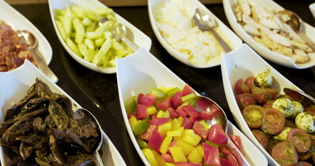 italian food - several fresh salads and vegetables on plate.