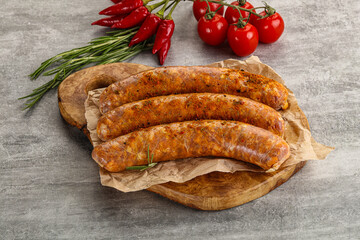 Raw sausages with spices and herbs