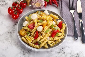 Italian pasta with mozzarella and tomato