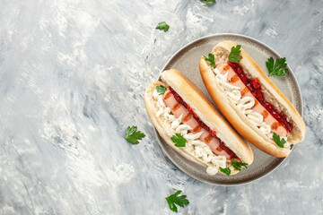 Hot dog grilled sausage in a bun with sauces. banner, menu, recipe place for text, top view