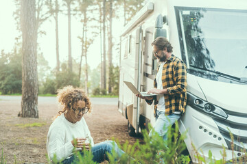 People living in rv vehicle motorhome camper van concept lifestyle. One woman having relax with...