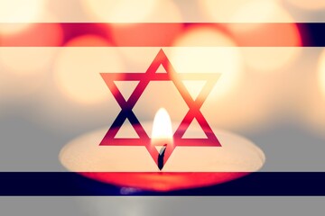 Burning candle and Israel flag. Holocaust Remembrance