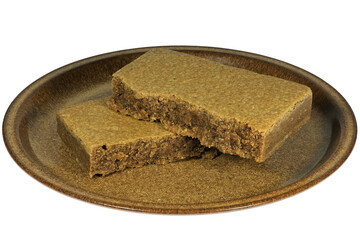 Dutch Blokzijler Brok (spiced biscuit) on a plate isolated on white background