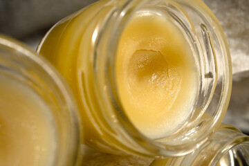 Stainless steel gua sha tool, massage cream. Close-up