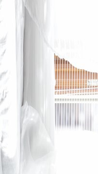 Moving transparent curtains at the window