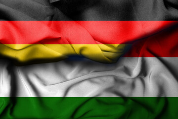 German flag illustration combines hungarian flag, satin texture waving decoration background. 3d illustration