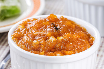 Brazilian pumpkin jam or pudding, with candied pumpkin jam in the background, tradition of the Brazilian June festivals