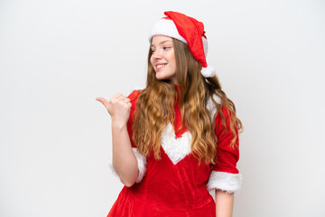 Young caucasian woman with Christmas dress isolated on white background pointing to the side to present a product