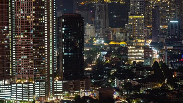 night time illuminated kuala lumpur cityscape traffic rooftop panorama 4k timelapse malaysia