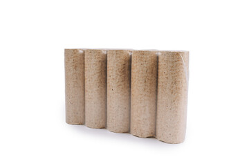 Fuel briquettes folded in rows on a white background. Wooden briquettes are an environmentally friendly fuel source that are used to start a fire. They are made by pressing of dry sawdust.