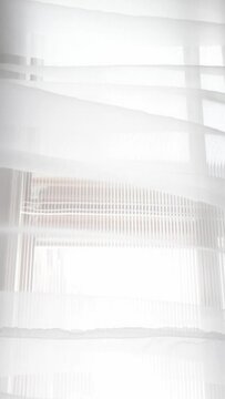 Moving transparent curtains at the window
