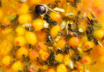 decoction of tea and sea buckthorn berries with a close-up top view