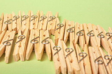 clothes clips on green background