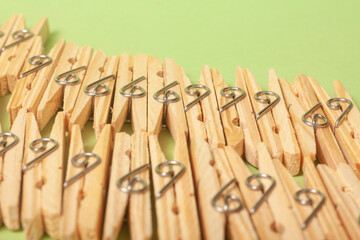 clothes clips on green background