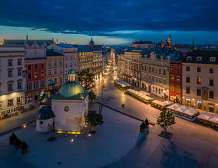 Main Square, St Adalbert church and Grodzka street illuminated in the night, Krakow, Poland - 688193422
