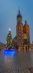 St Mary's church on Main Square with Christmas Tree in winter Krakow, illuminated in the night