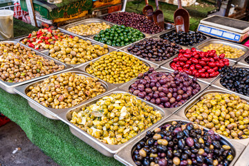 Variously prepared olives are sold at the Carmel market in Tel Aviv-Jaffa - obrazy, fototapety, plakaty