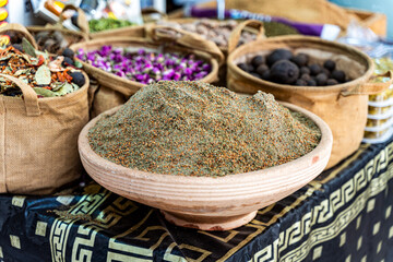 Bowls with oriental spices are offered at the Carmel Market in Tel Aviv