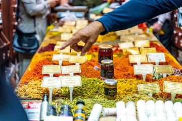 Hand pointing at spices at the bazaar