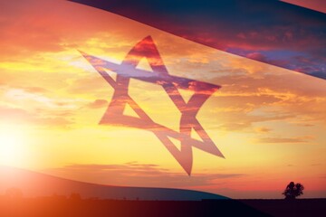 Israel flag over beautiful sky at sunset background