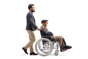 Man pushing an elderly injured man in a wheelchair