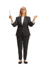 Full length portrait of a woman conductor directing a musical performance