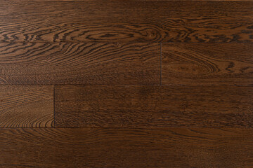 Texture of natural dark brown oak parquet. Wooden boards for polished laminate. Hardwood background