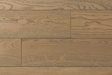 Fototapeta premium Texture of natural oak parquet close-up. Wooden boards for polished laminate. Hardwood sample background